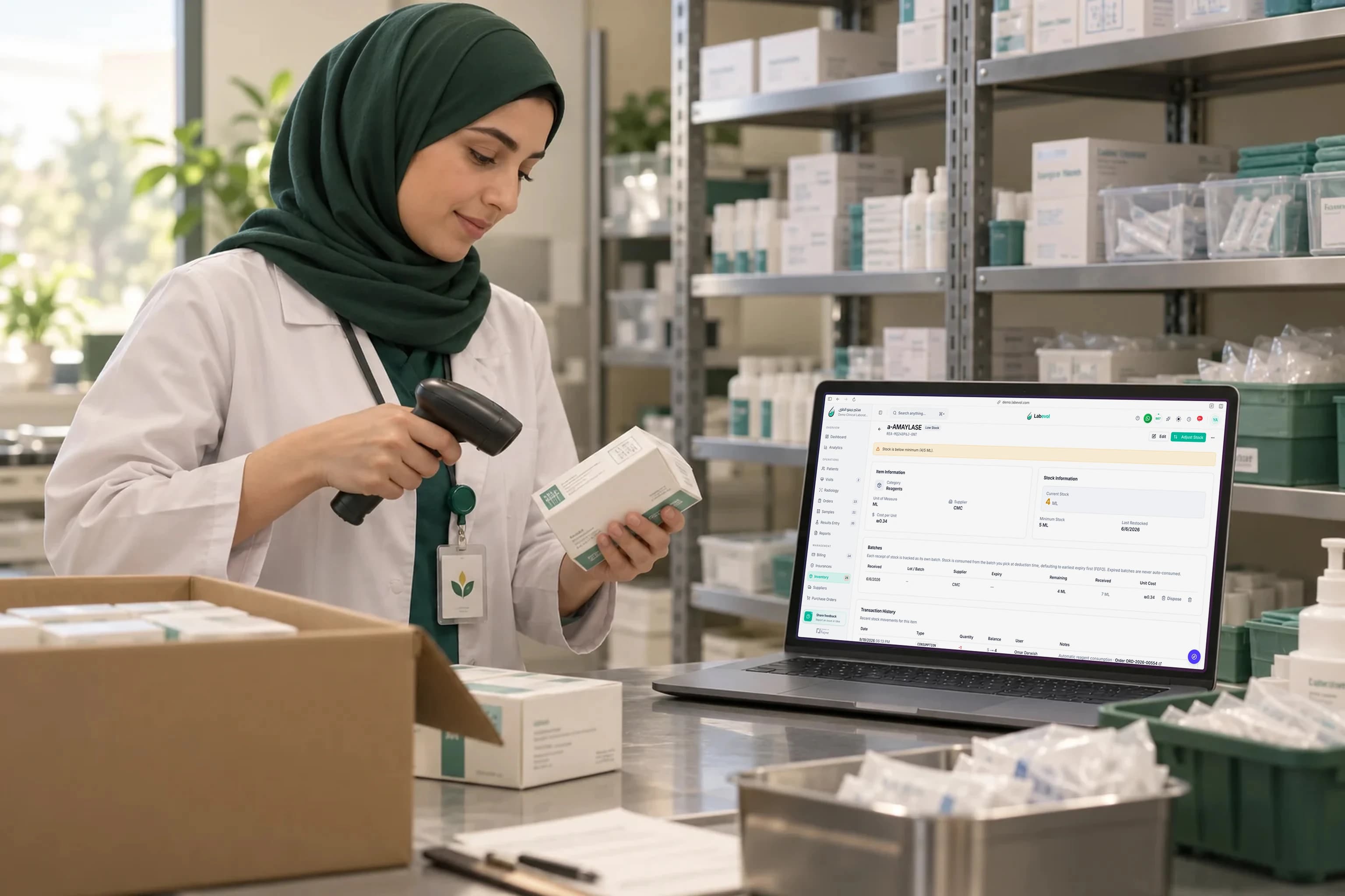 Illustrative scene of a staff member adding supplies while Labevol shows a low-stock alert on a laptop